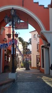 an archway over a street in a town at Bright beachfront apartment with ocean view in Villa Gesell