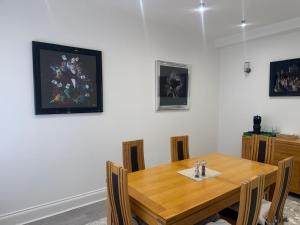 a dining room with a wooden table with chairs at Nest in Northumberland 2 in Blythe +11 photos