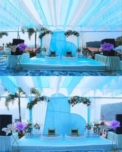 a blue and white tent with a table with flowers at Mountain Breeze Resort, Mahabaleshwar in Mahabaleshwar +105 photos