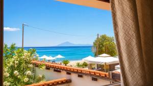 a view of the beach from a hotel window at Sea breeze 2 in Limenaria