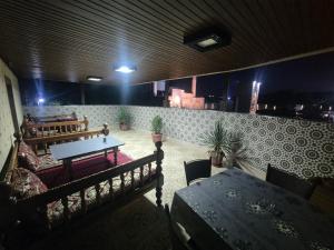 a dining room with a table and a table and chairs at HOTELVAZIRA in Samarkand +12 photos