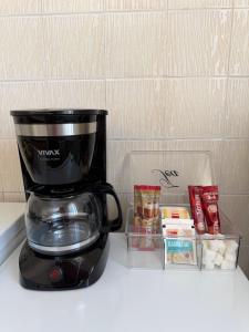 a coffee pot sitting on top of a counter at Studio Apartman ISRA 1 in Palit