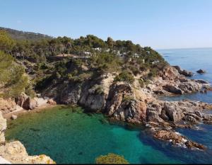 an island in the ocean with blue water at Casa Bon Matí in L'Ampolla