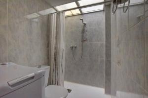 a bathroom with a shower and a toilet at Casa Bon Matí in L'Ampolla +33 photos