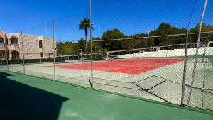 a tennis court with a net on a tennis court at Casanova in Calpe