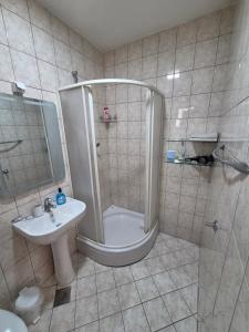 a bathroom with a shower and a sink at City Center Stay in Visoko
