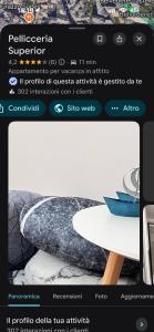 a page of a website with a table and a boat on it at Centro Storico Caruggi 2min Acquario Pellicceria Superior Loft Palazzo Rolli in Genoa