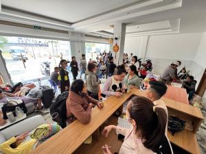 a group of people sitting around tables in a room at THANH THỦY HoTel in Hà Tiên