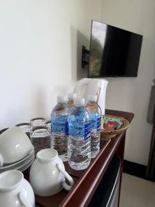 a group of bottles of water sitting on a counter at Peak Blooms Ella in Ella