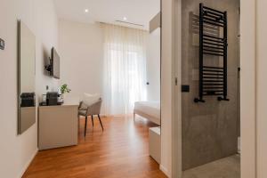 a living room with a door leading to a bedroom at Lumen Boutique Stay in Naples +53 photos