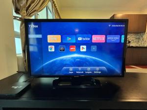 a flat screen tv sitting on top of a table at Tiara Homestay Desaru - Nature view in Bandar Penawar