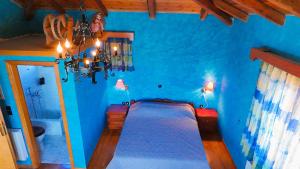 a blue bedroom with a bed in a blue room at Villa Evmaria in Áyios Konstandínos +45 photos