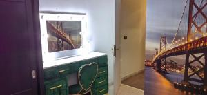 a bathroom with a window with a view of a bridge at Coquet ac accès autonome in El Aouina Station