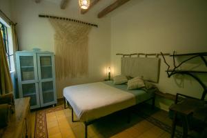 a bedroom with a bed in the corner of a room at Precioso departamento privado in Morelia +14 photos