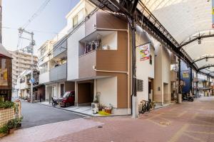 an empty street in a city with a building at nonon in Osaka