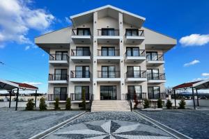 a large white building with a lot of windows at Dada Otel in Ezine