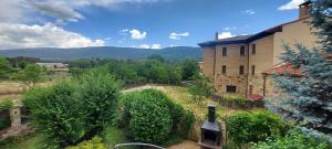 an aerial view of a building with a bottle of wine at La Casa de la Huerta in Vinuesa
