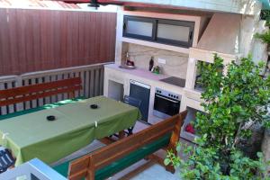 an aerial view of a patio with a table and bench at Casa Bellora in Kamenari