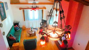 an overhead view of a living room with a chandelier at Villa Evmaria in Áyios Konstandínos