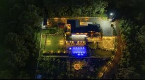 an overhead view of a house at night with lights at Sharuu Residency in Msaranga