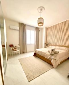 a bedroom with a large bed and a window at La Lidia in Sassari +15 photos