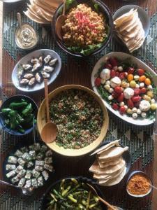 a table with many different types of food on it at Flusshaus BnB Okavango in Brugg +2 photos