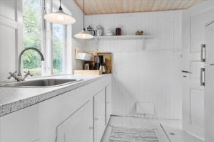 a white kitchen with a sink and a window at 30001-Malling-Hasselvaenget-7 in Malling +21 photos
