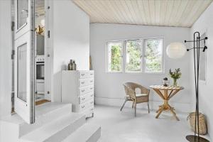 a white room with a table and a chair at 30001-Malling-Hasselvaenget-7 in Malling