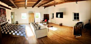 a large living room with a couch and a table at Phreude Loft in Aschach an der Donau