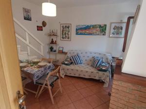 a living room with a couch and a table at The Lake Chime in Colonno