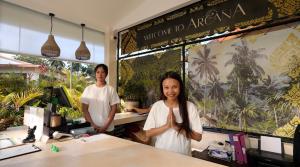 a man and a woman standing in front of a counter at Arcana Wellness Center - Adults Only in Ko Phangan +68 photos