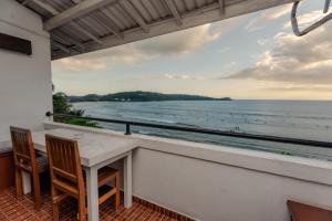 a balcony with a view of the ocean at Sahana beach in Galle