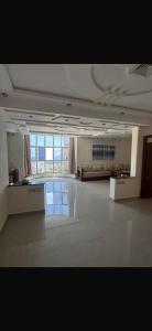 a large room with a large window in a building at Ajdir in Ajdir