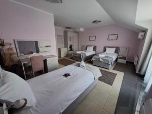 a hospital room with two beds and a tv at SOBE Svilajnac in Svilajnac