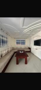 a living room with a couch and a table at Ajdir in Ajdir +34 photos