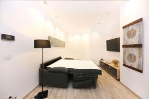 a room with a bed and a table in it at Domus Halo F in Pamplona