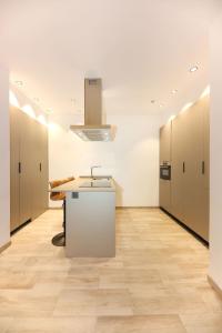 an office with a row of lockers and a counter in a room at Domus Halo F in Pamplona