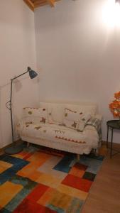 a bedroom with a bed with pillows on it at Casa dos Malmequeres - Alegrete in Portalegre