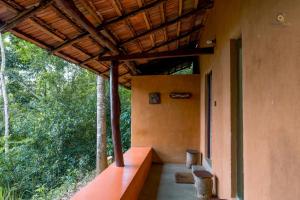 an outside view of a building with a porch at Bathle Eco Resort in Mawanella +14 photos