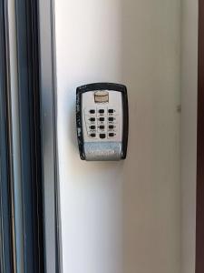 a telephone on the side of a wall at Giordano Bruno 8 in Brindisi