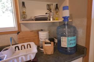 a large bottle of water sitting on top of a counter at Equus Acres in Boston Bar