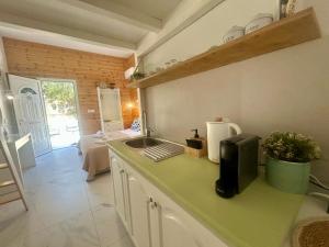 a kitchen with a sink and a counter top at Sea and Sand Elafonisos in Elafonisos
