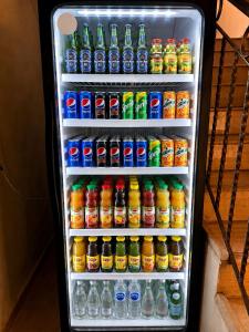 a refrigerator filled with lots of drinks and sodas at Sky Royal Hotel in Petra