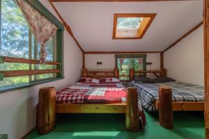 a bedroom with two beds in a house at Woods End Landing in Bamfield