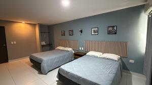 En eller flere senge i et værelse på hotel 11once