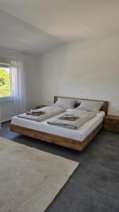 a bedroom with a large bed in a room at Villa DARIAN in Sukošan +16 photos