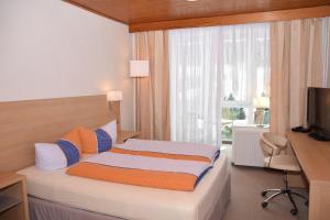 Ένα ή περισσότερα κρεβάτια σε δωμάτιο στο Marschalls Hotel Am Rennsteig +17 φωτογραφίες