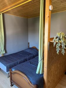 a bedroom with two beds in a room at Le mignon in Pontcharra