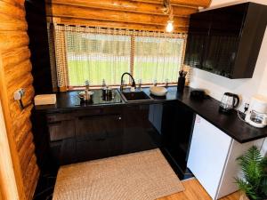 a kitchen with a sink and a counter top at Radawski Chill in Radawa +5 photos