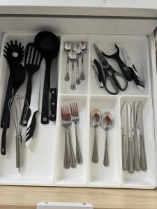a drawer filled with silver utensils and spoons at Apartamento Casa Leo in Playa Blanca